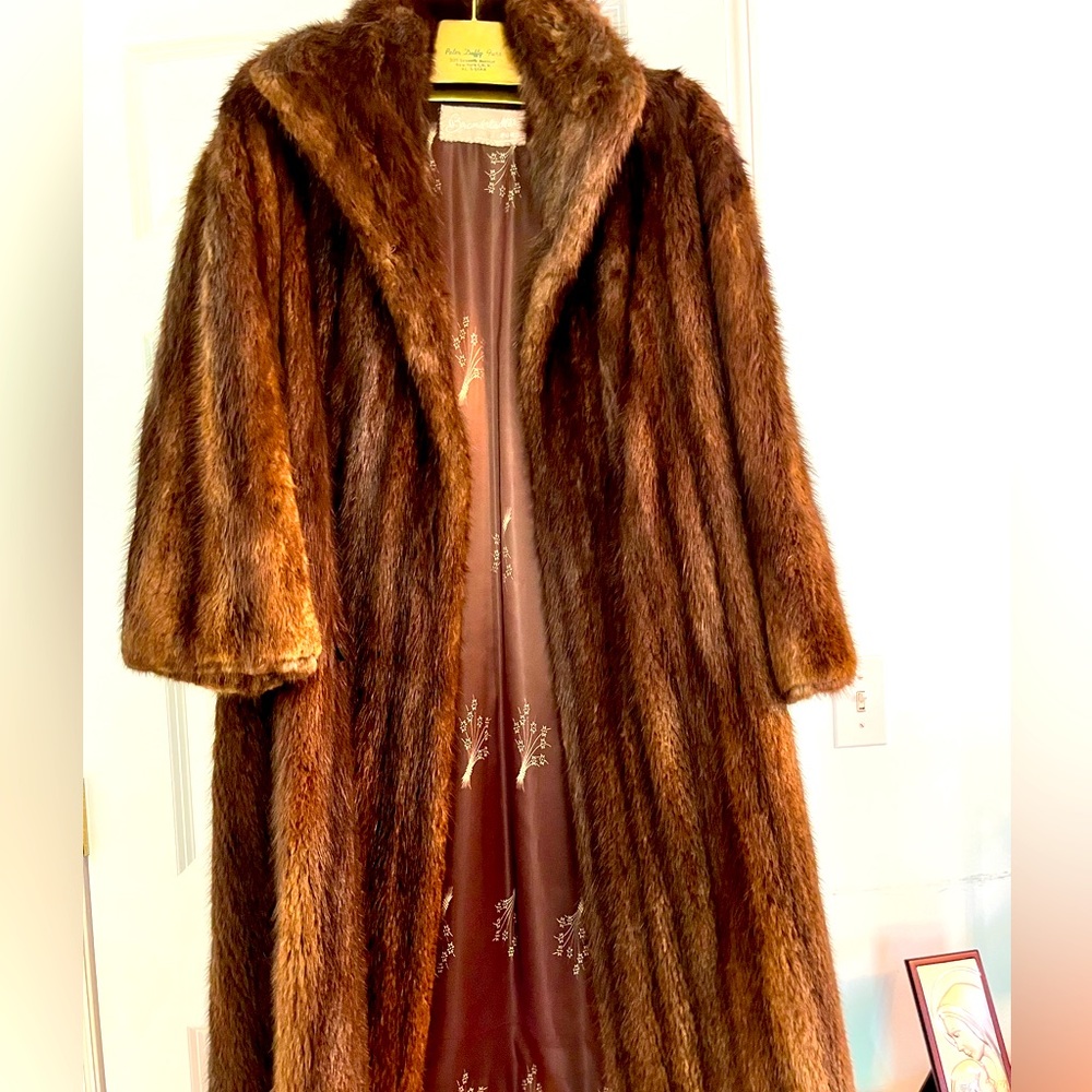 The well known Peter Duffy Furs in New York, NY.  Long mink fur coat for winter.